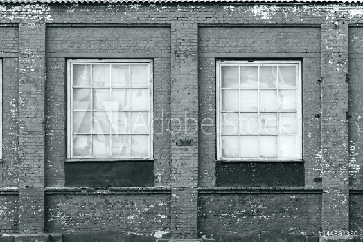 Picture of Brick wall of an old factory with windows